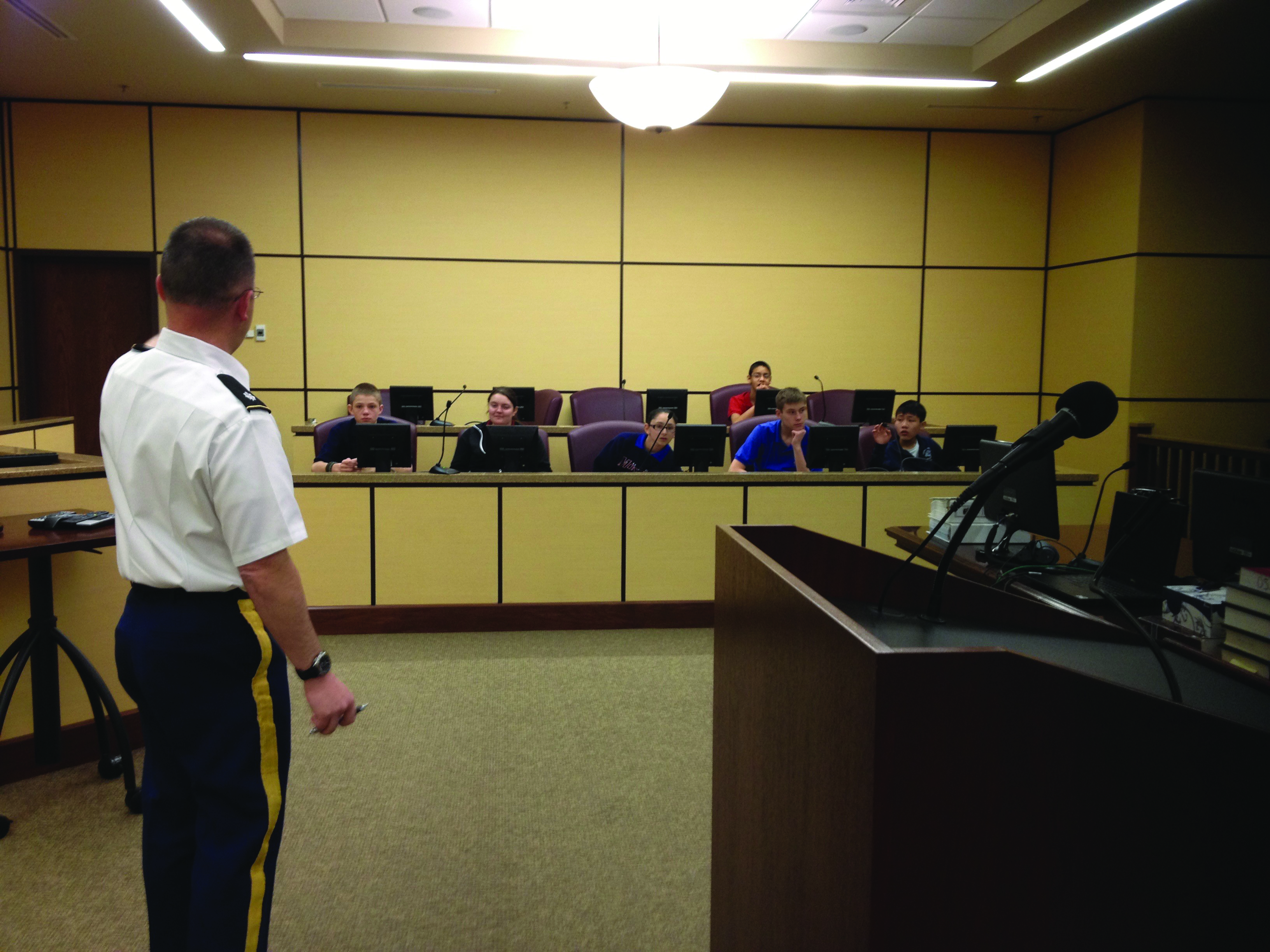 Then-LTC Hayes instructing local junior high-school students, and perhaps future judge advocates, before presiding over their mock trial in Fort Bliss, TX, circa
        2014. (Photo courtesy of author)